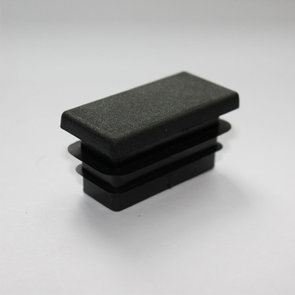 картинка Заглушка пластик черная 60х30мм от магазина Евродом